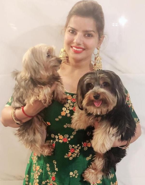 Madhu Sharma with her two pet dogs