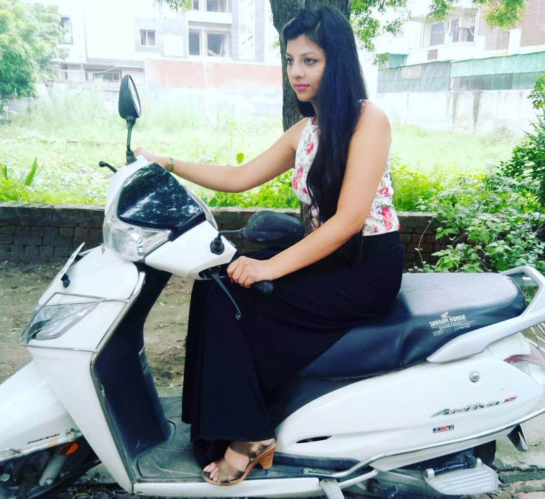 Kanak Yadav with her Honda Activa Bike