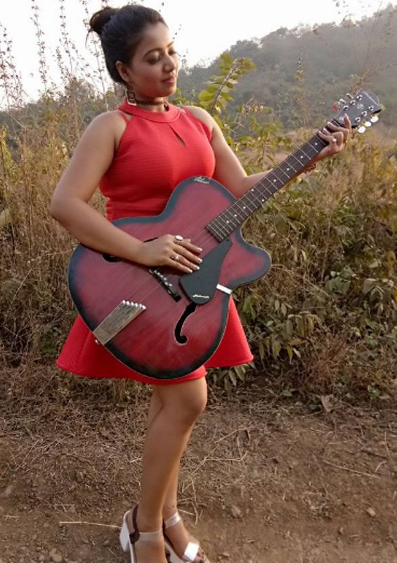 Rekha Mona Sarkar Playing Guitar