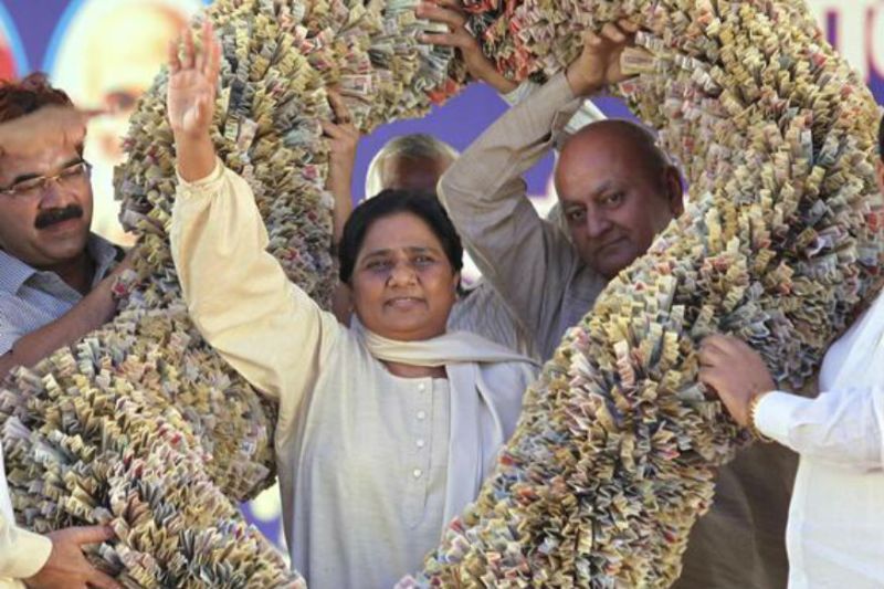 Mayawati's supporters presenting her a huge garland made of Indian currency notes
