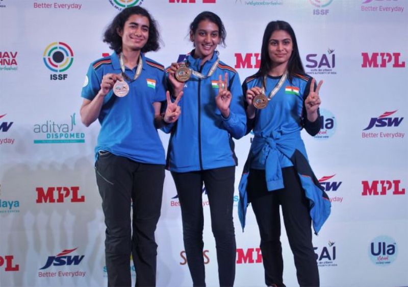 Yashaswini Singh Deswal, Shri Nivetha, and Manu Bhaker after winning the gold medal in the women's team 10m air pistol event at the World Cup Rifle Shotgun