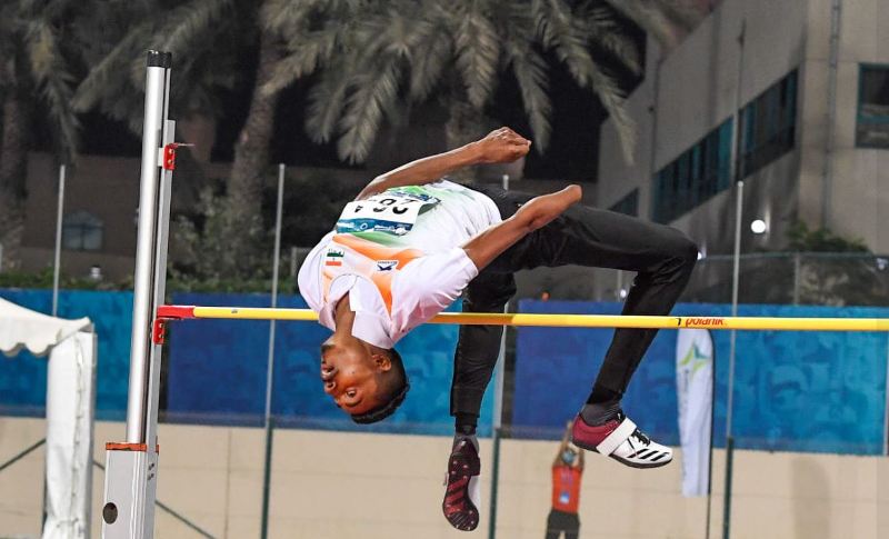 Nishad Kumar while performing high jump