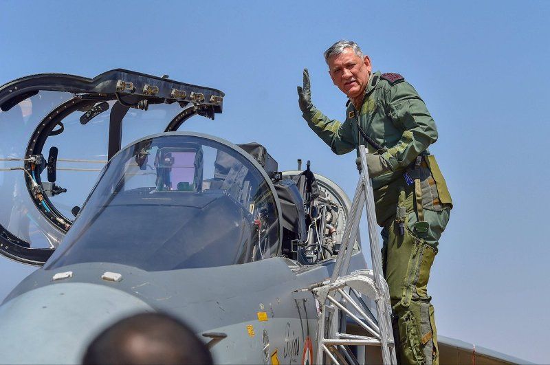 Bipin Rawat waving while going to fly LCA Tejas