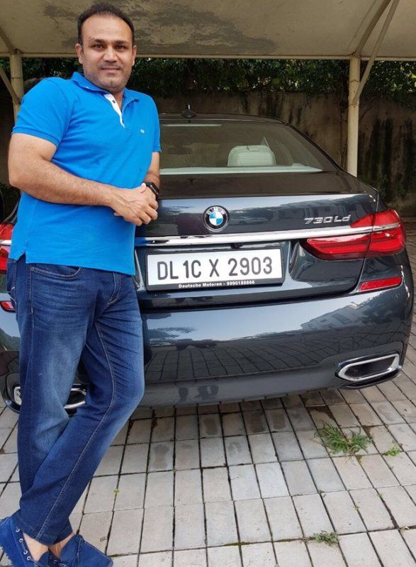 Virender Sehwag with his BMW-series 7 car