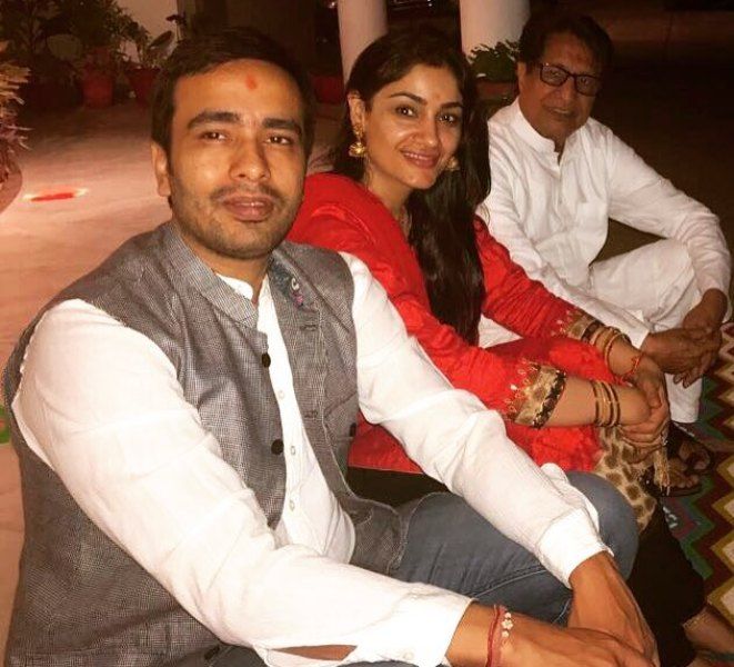 Charu Singh with her husband and father-in-law