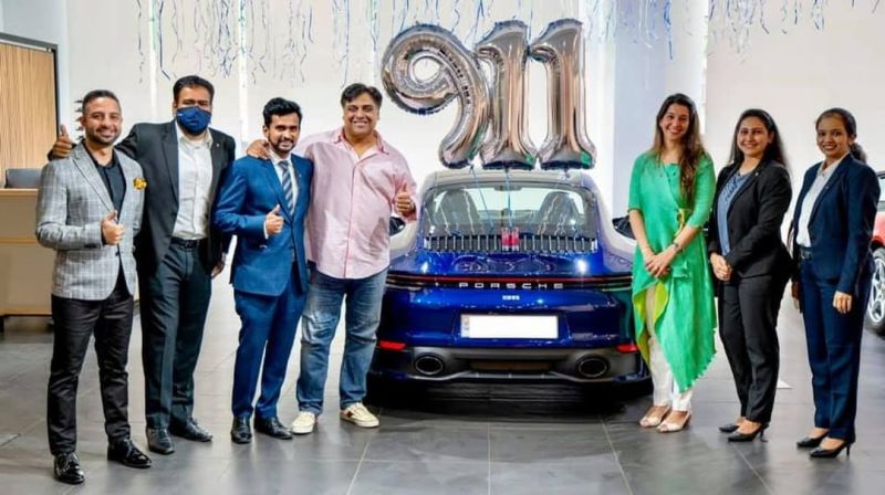 Ram Kapoor posing with his new Porsche car
