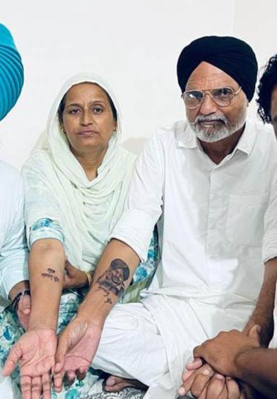 Sidhu Moosewala’s father, Balkaur Singh, and mother, Charan Kaur, showing tattoos they got inked