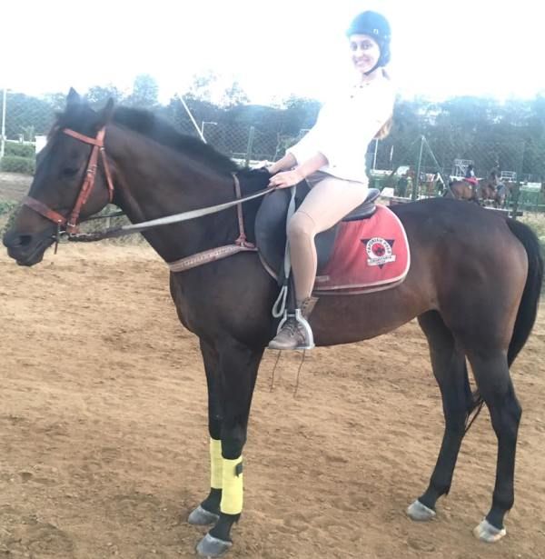 Anusha Dandekar riding a horse