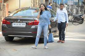 Sophie Choudry with her BMW car