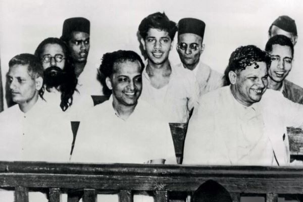 Vinayak Savarkar (wearing a black cap, behind Nathuram Godse and his fellow accused) at the Mahatma Gandhi assassination trial at the special court at the Red Fort, May 27, 1948