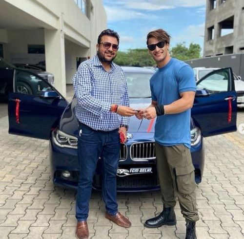 Asim Riaz with his BMW 5 Series M Sports car
