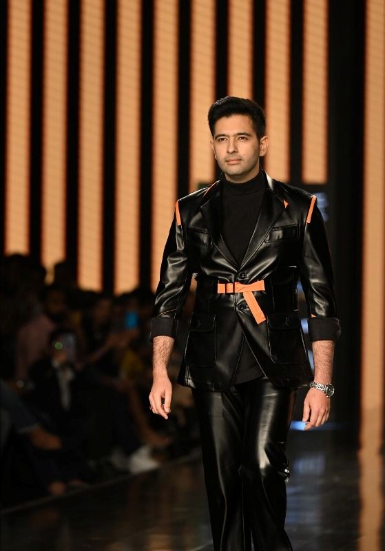 Raghav Chadha walking the ramps for designer Pawan Sachdeva at the Lakme Fashion Show in New Delhi in March 2022