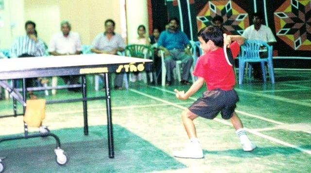 Harmeet Desai playing table tennis with his father
