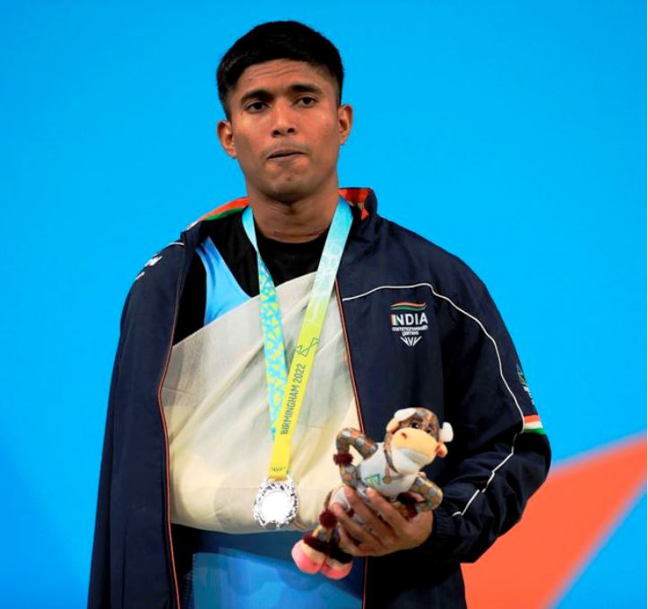 Sanket Mahadev Sargar wearing his silver medal and an arm sling for his right arm injury at Commonwealth Games 2022