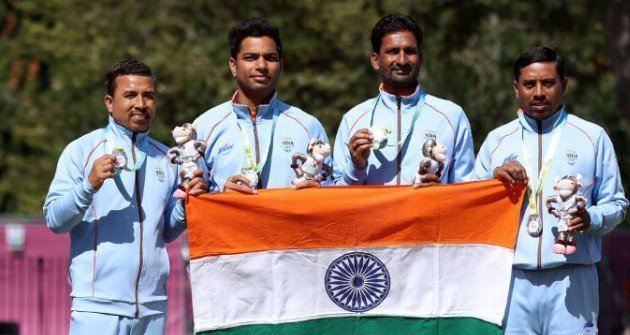 Silver medalists Sunil Bahadur, Navneet Singh, Chandan Kumar Singh (second from right), and Dinesh Kumar of India pose during Men’s Fours Lawn Bowls – medal ceremony of Birmingham 2022