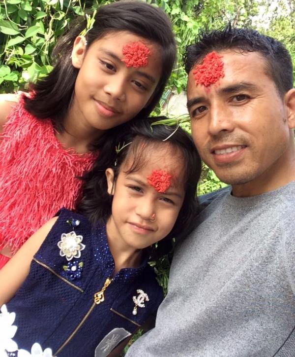 Sunil Bahadur with his daughters