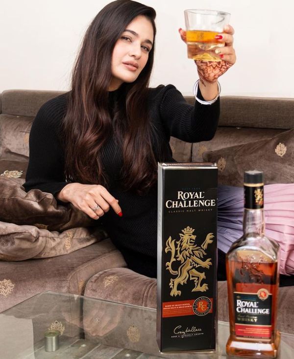 Yuvika Chaudhary drinking alcohol Royal Challenge Whisky