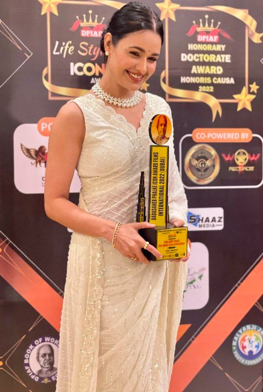 Yuvika Chaudhary with the Dadasaheb Phalke International Film Festival Awards in 2022