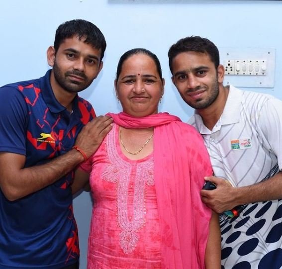 Amit Panghal with his mother and brother