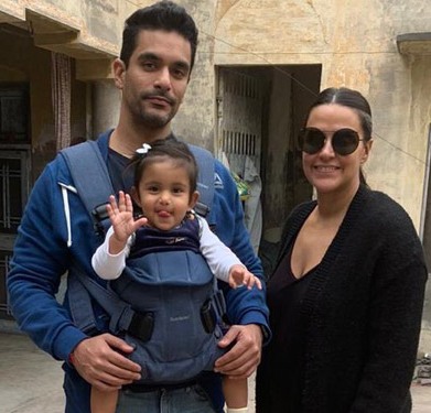 Angad Bedi with his daughter and wife