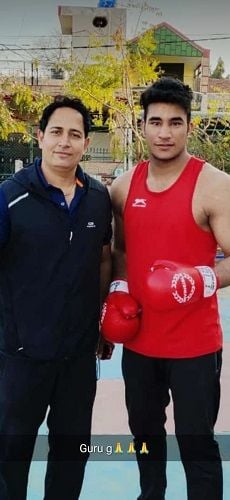 Sagar Ahlawat with coach Hitesh Deswal