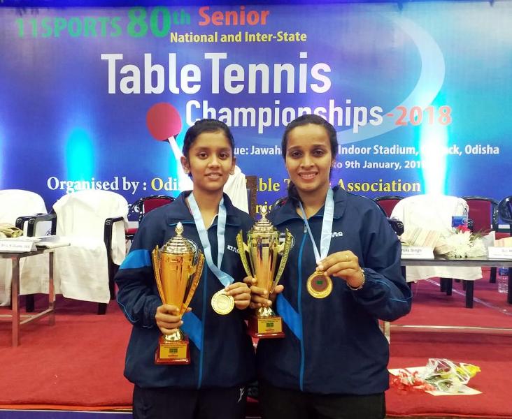 Sreeja Akula with her women’s doubles partner, holding her gold medal